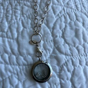 Origami Owl locket on extra long chain with a heart charm and a ‘love’ charm.